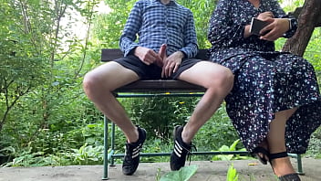 Cheerful milf jerks off strangers and takes photos on the street