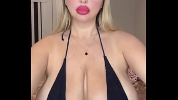 Hot MILF with huge natural breasts plays with her bra