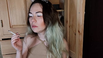 Modest stepsister smokes a cigarette