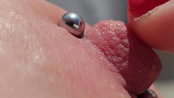 Playing Pierced Nipples Close Up on Balcony