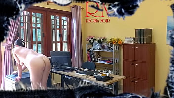 The naked secretary is cleaning up the office. Voyeur camera.