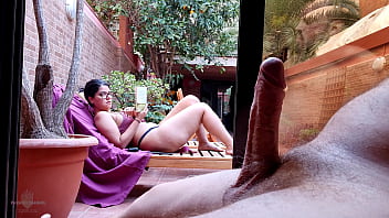My stepson takes out his big cock on the terrace, gets excited looking at me behind the window and showing his erection to the neighbors. My nipples are very hard and I'm not wearing a bra.