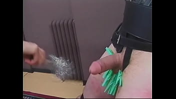 Mature dominatrix Mistress Scarlett pours hot wax on dude's balls and cock