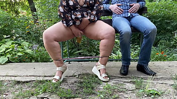 Sexy MILF with gorgeous legs pisses into a glass and gives it to a stranger