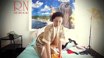 Housewife laid out sexy lingerie and outfits on the bed. She tries on panties, corsets, bras, socks, stockings, tights, peignoir. 1