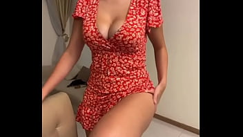 My stepmom is sitting in a red dress and showing her tits