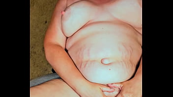 Playing with her clothes while I piss on her pussy