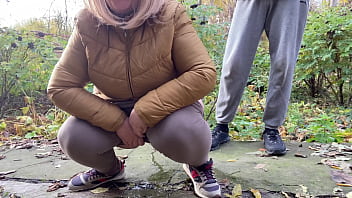 Depraved curvy MILF in leggings squats down and pisses next to me